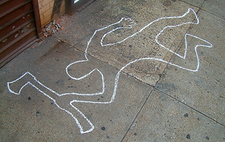 A chalk outline shows where police found "Crazy" Leo Krafchek's body.